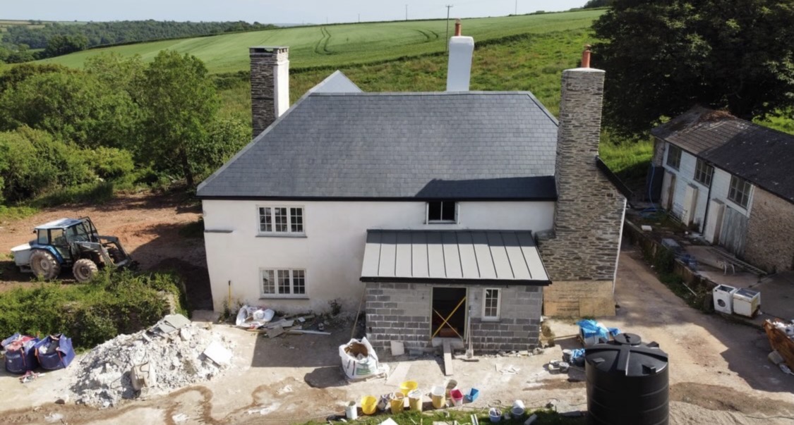 House under construction with new masonry, render and porch roof